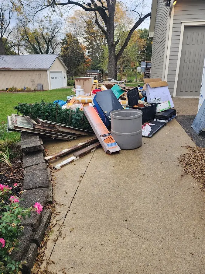 Dumpster being loaded with debris for Commercial Dumpster Rental in Glen Burnie
